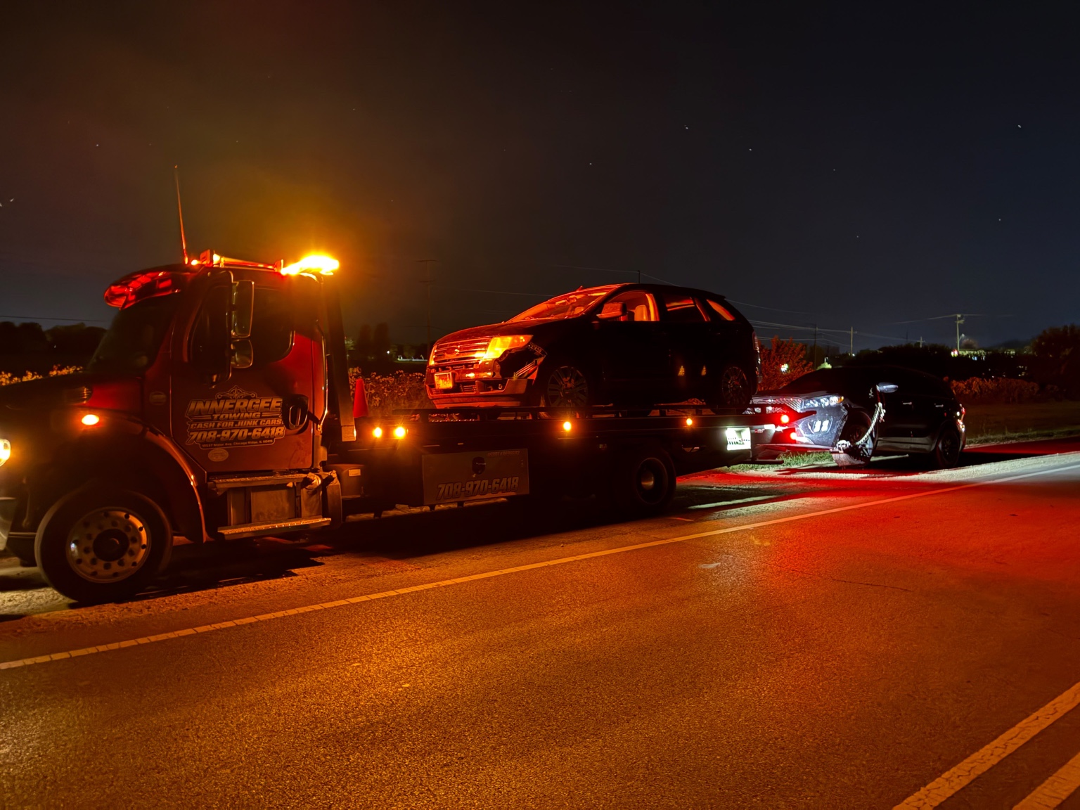 Two vehicles transported at night