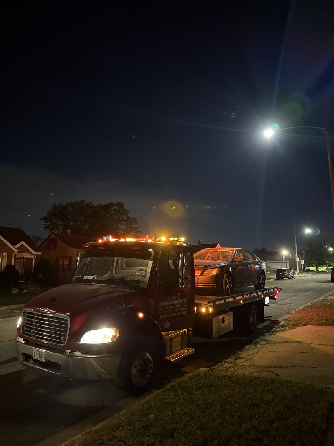 Nighttime sedan pickup with the Innergee flatbed